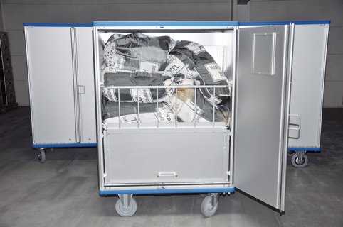 Individual solution with fold-down shelves and retention bar - for clean and dirty linen